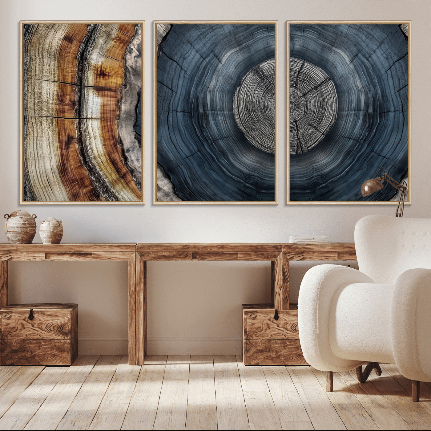 A stunning close-up of a tree trunk showing the intricate, circular growth rings, showcasing the natural textures and rich contrasts in deep blues, browns, and silvers.
