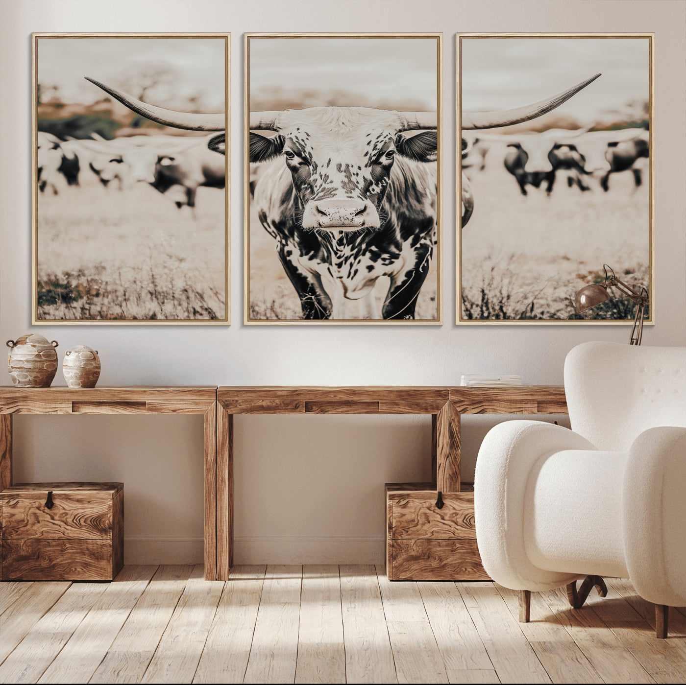 Canvas of a speckled Texas longhorn standing boldly in a field with a herd behind, perfect for rustic western or farmhouse wall decor.