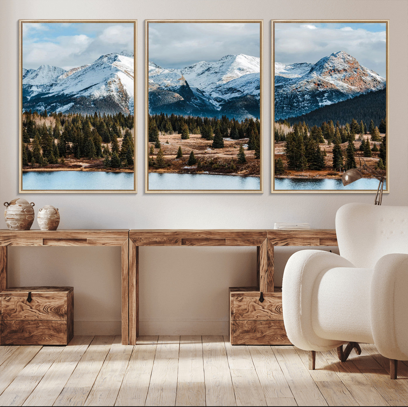 Framed canvas of snowy mountain peaks with pine forest and alpine lake, perfect for winter cabin or wilderness-inspired home decor.