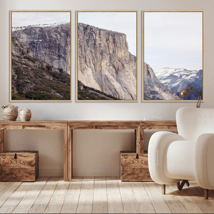 Framed canvas of El Capitan’s vertical granite face in Yosemite with snowy peaks, ideal for Sierra minimalism or mountain-inspired decor.