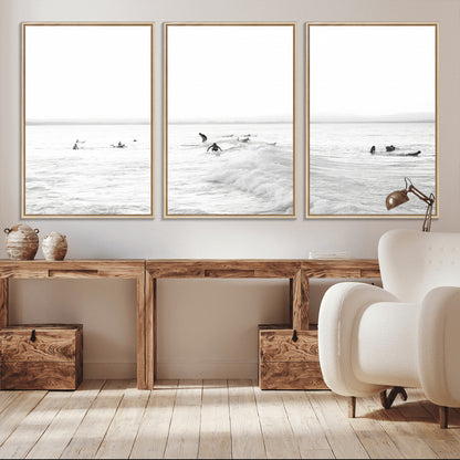 Monochrome photo of surfers riding and waiting on ocean waves, ideal for surf-themed or coastal energy wall decor.