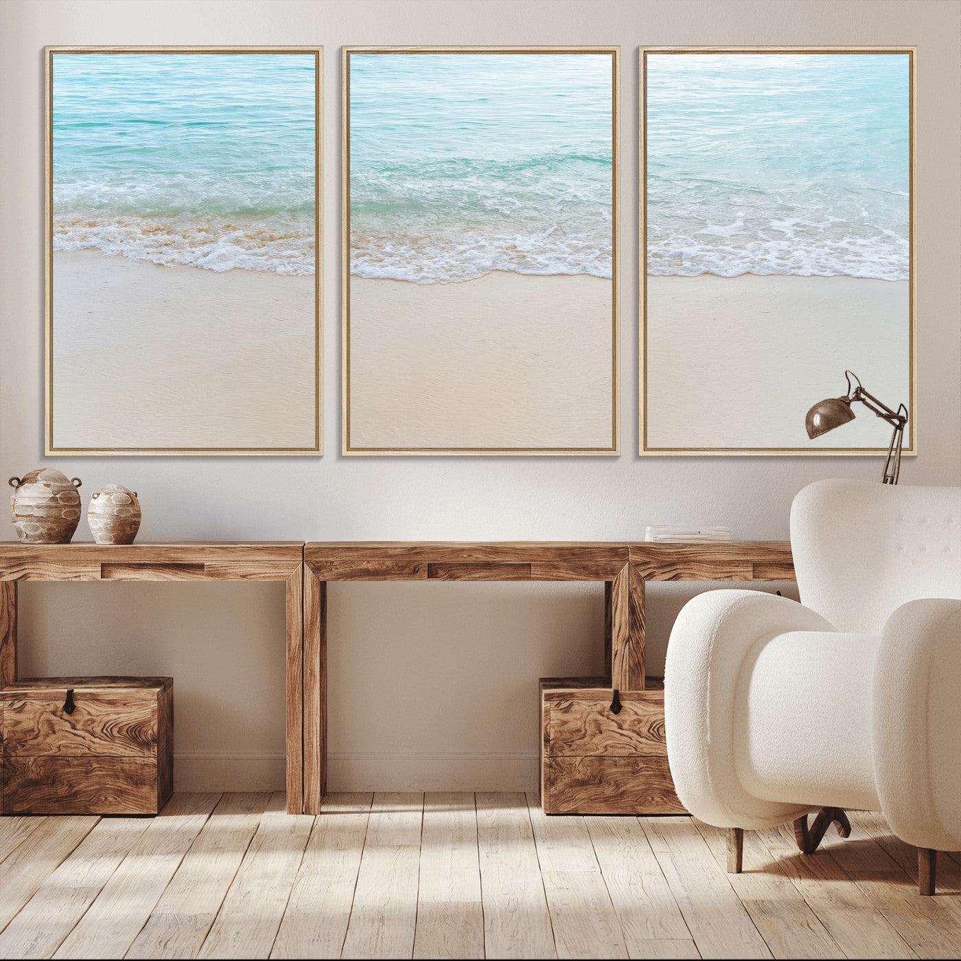 Soft shoreline with gentle aqua waves on smooth sand, ideal for minimalist coastal or pastel ocean-inspired home wall decor.