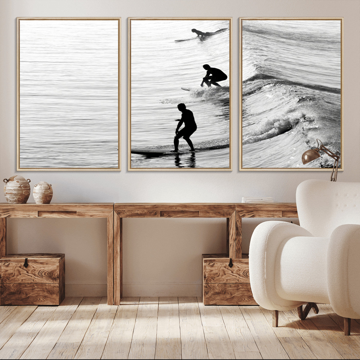 Black and white photo of surfers riding waves in a moody, high-contrast scene, ideal for modern coastal or surf-inspired home decor.