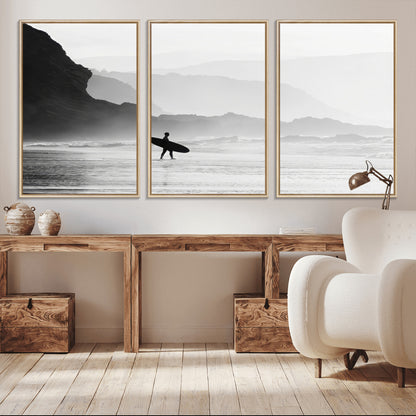 A lone surfer walking along a misty beach with cliffs in the background, carrying their board, capturing a serene and minimal ocean moment.
