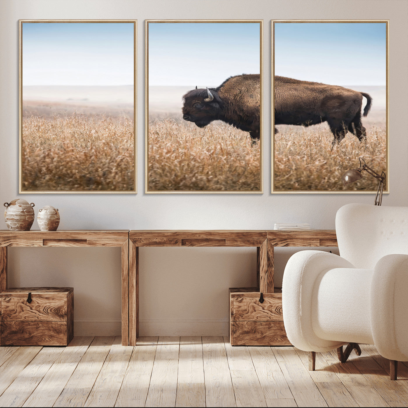 A majestic bison standing in an open prairie field, its strong form blending into the golden grass under a vast blue sky, evoking the wild spirit of the American plains.