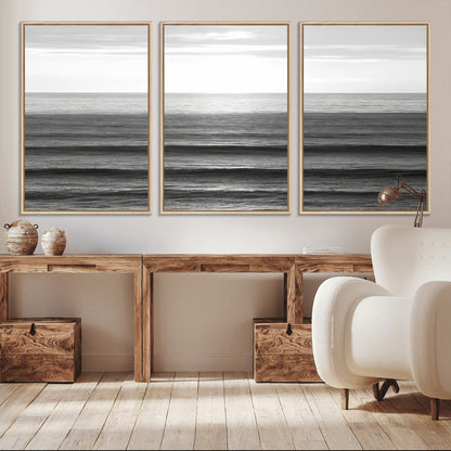 Minimalist black and white ocean view with layered waves reflecting sunlight, evoking a sense of calm and coastal serenity.