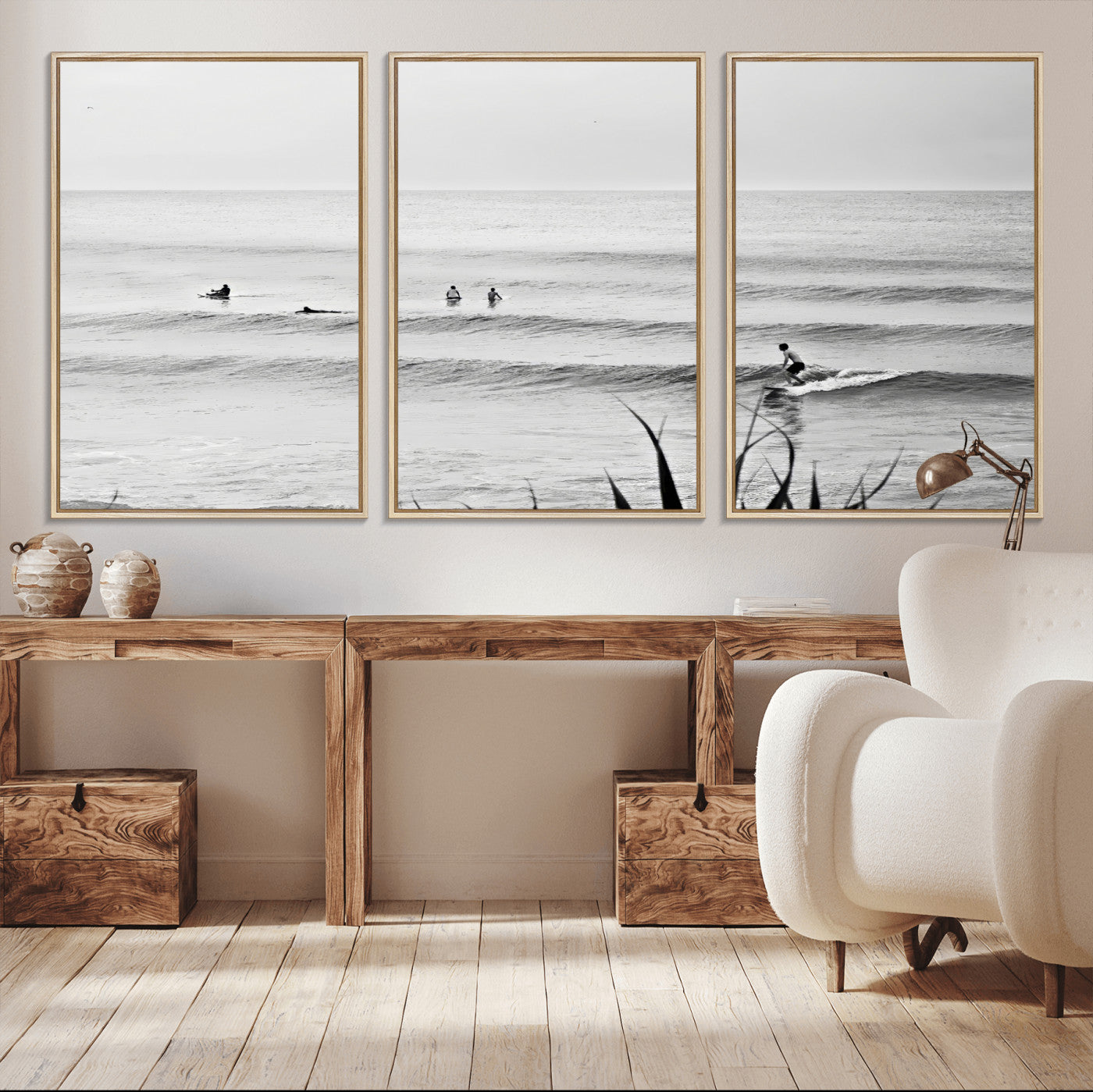 Monochrome canvas of surfers on calm ocean waves, ideal for minimalist coastal or beach-inspired interior decor.