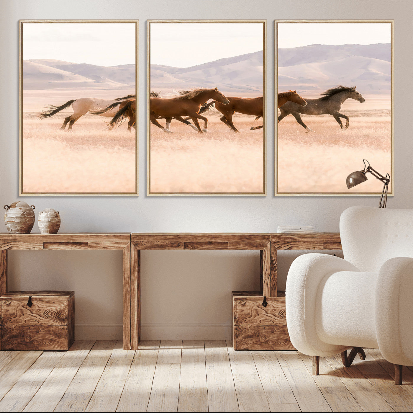 A herd of wild horses galloping through a sunlit desert plain with mountains in the background, perfect for rustic or western-themed wall decor.