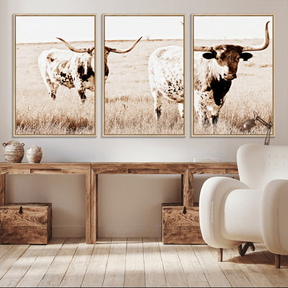 Two Texas longhorn cows standing in a sepia-toned pasture, evoking rustic charm perfect for farmhouse or western country interiors. (
