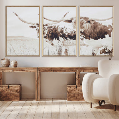 Two longhorn cows standing in a sepia-toned pasture with soft light, ideal for rustic or farmhouse-themed neutral wall decor.