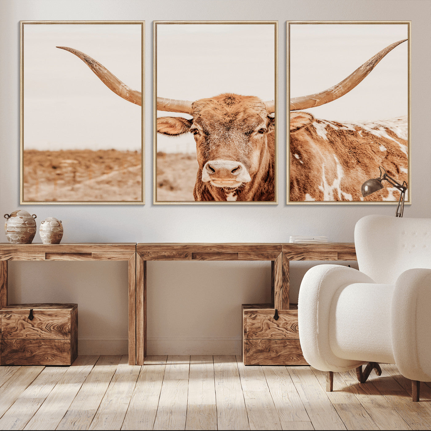 A longhorn bull standing proudly in a sunlit desert field with warm neutral tones, ideal for rustic western or farmhouse interiors.