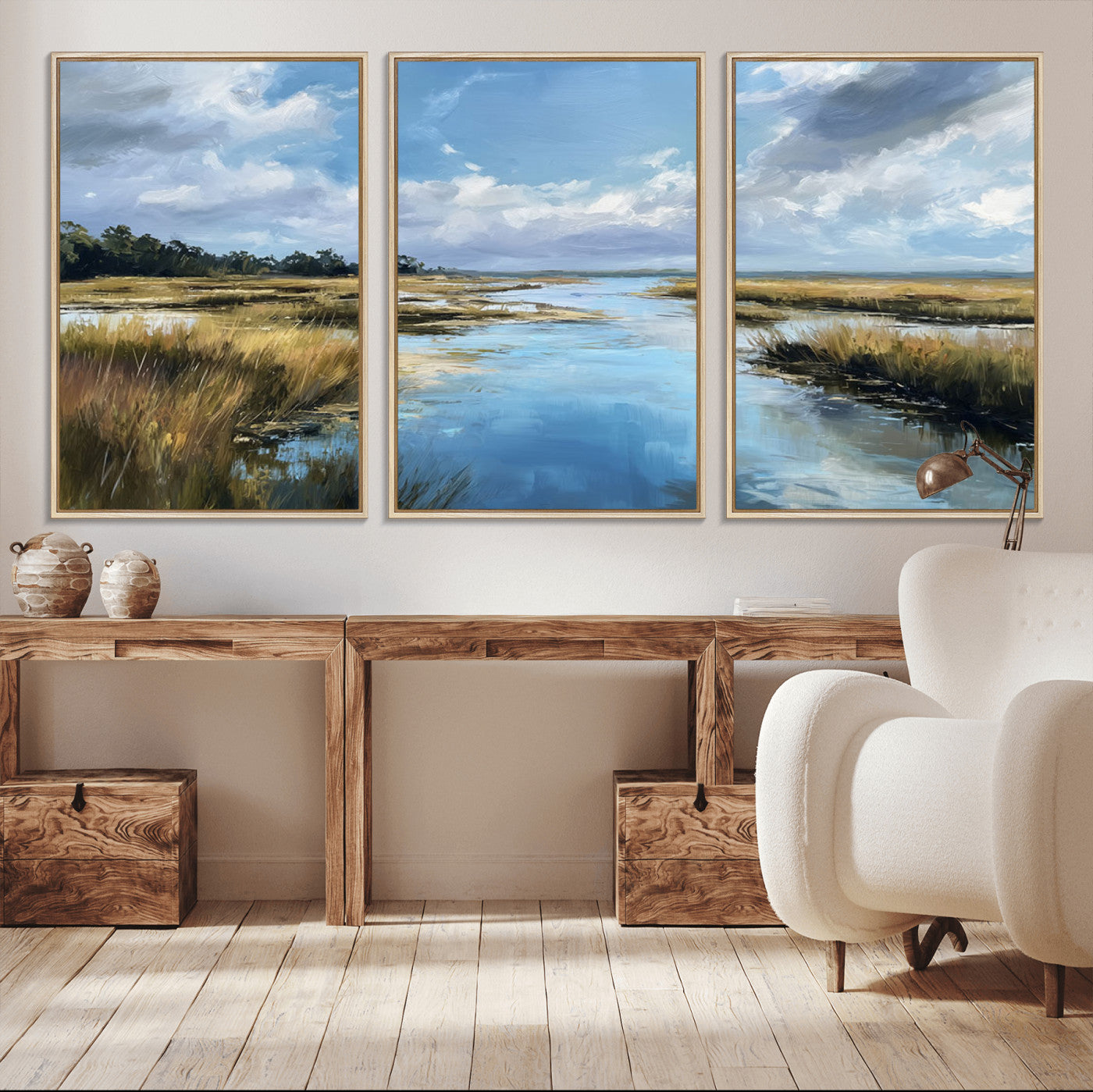 A beautiful, painterly landscape of a calm river winding through a marsh, with vibrant green grasses and a bright blue sky filled with fluffy clouds.