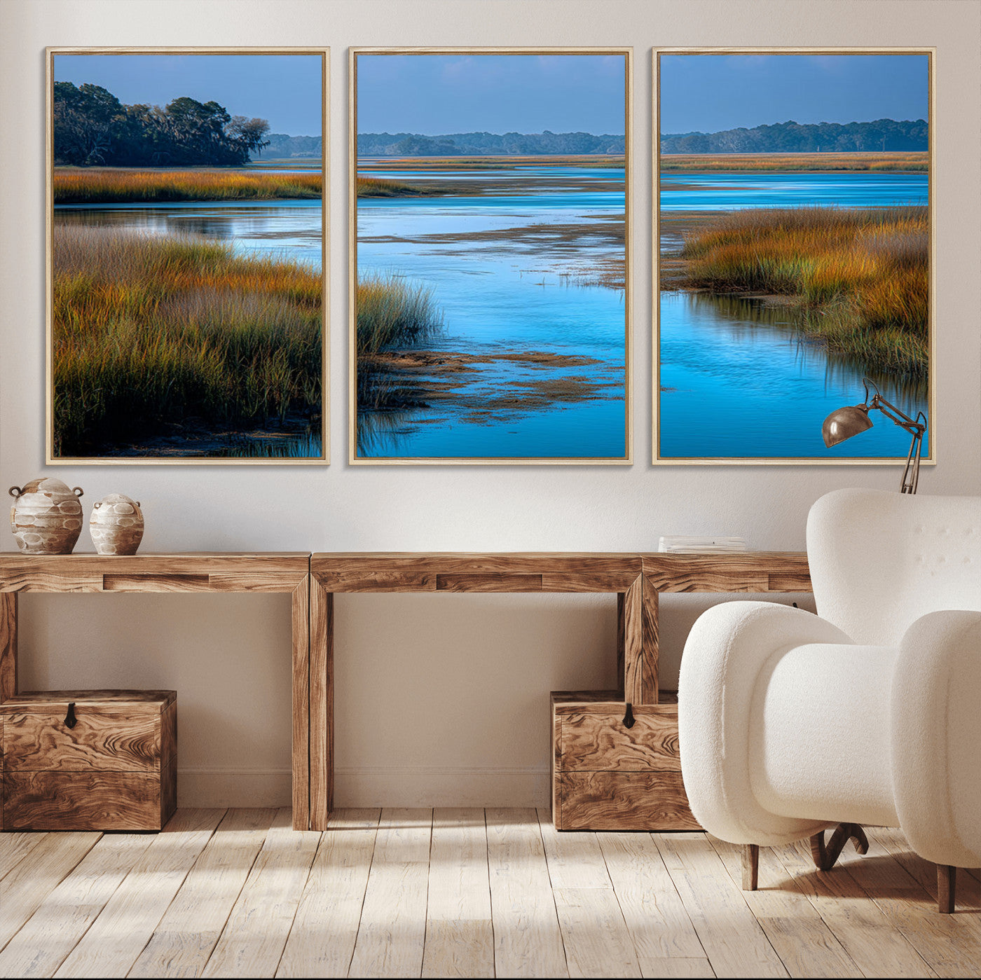 A peaceful marshland scene with calm blue water reflecting the surrounding grasses and trees, capturing the beauty of nature in a serene landscape.