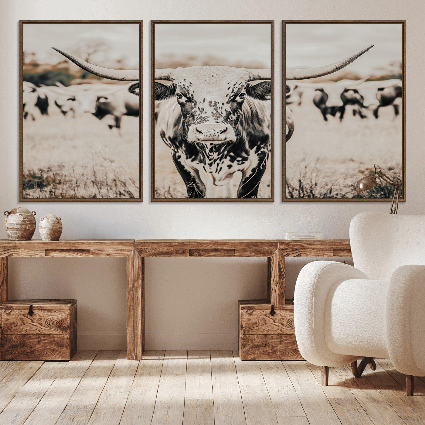 Canvas of a speckled Texas longhorn standing boldly in a field with a herd behind, perfect for rustic western or farmhouse wall decor.