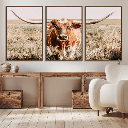 Framed longhorn cow canvas wall art with rustic prairie background, western animal print perfect for farmhouse or ranch style decor