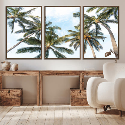 Framed canvas of tall palm trees reaching into a tropical sky, ideal for beach home or relaxed island-inspired wall decor.