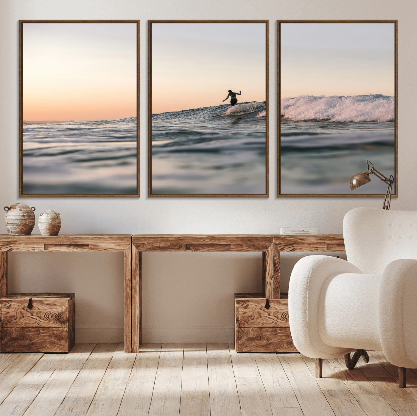 Framed canvas of a female surfer balancing on a wave at sunset, perfect for serene surf or ocean-inspired coastal decor.