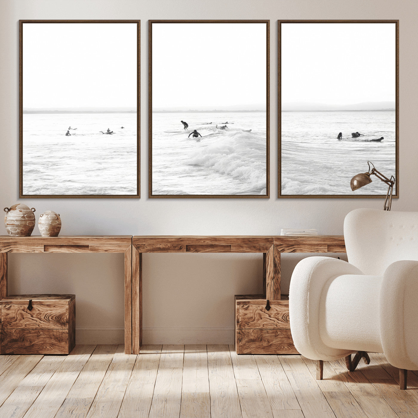 Monochrome photo of surfers riding and waiting on ocean waves, ideal for surf-themed or coastal energy wall decor.
