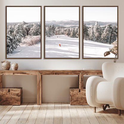 Bright ski trail lined with snow-covered pines and a skier in orange, perfect for alpine adventure or winter sports-inspired decor.