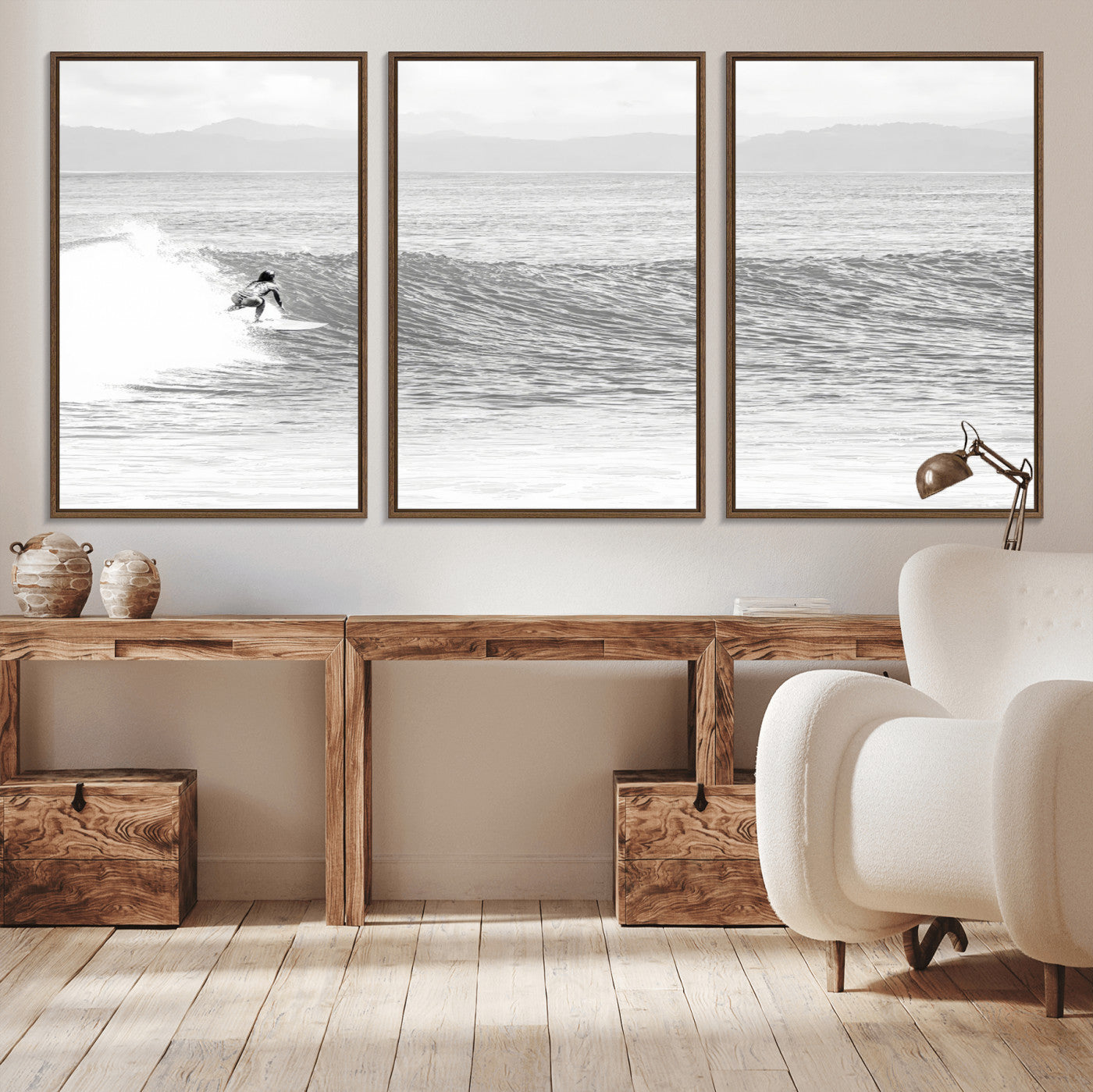 Monochrome photo of a surfer riding a wave with distant mountains, ideal for coastal motion or black and white surf-themed wall decor.