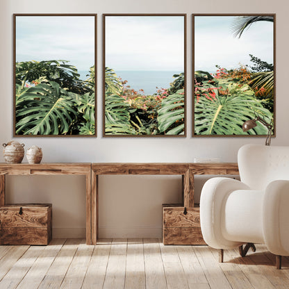 Monstera leaves and tropical flowers framing a calm ocean view, ideal for tropical coastal or exotic jungle-style interior wall decor.