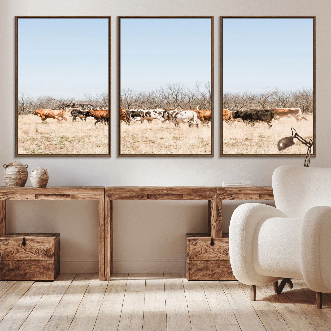 Framed wall art of Texas longhorn cattle walking through a dry, neutral-toned prairie, perfect for rustic farmhouse or western-themed home decor.