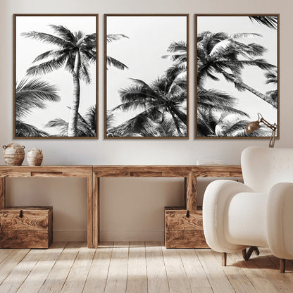 Black and white canvas of tall palm trees in moody tones, perfect for modern tropical minimalist or coastal-style home decor.