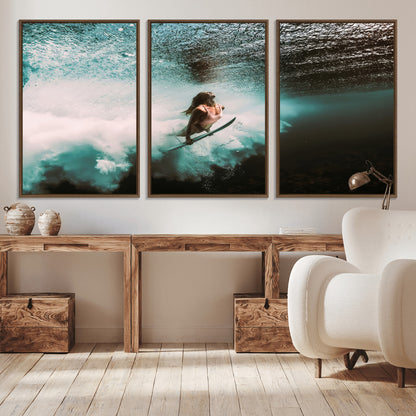 Vibrant underwater photo of a female surfer diving through turquoise waves, perfect for coastal boho or surf-inspired home decor.