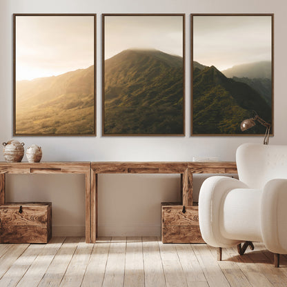 Sunlit mountain peak with mist rolling over its rugged slopes, bathed in golden light, creating a warm and tranquil nature-inspired scene.