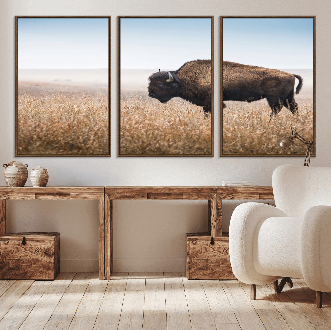 A majestic bison standing in an open prairie field, its strong form blending into the golden grass under a vast blue sky, evoking the wild spirit of the American plains.