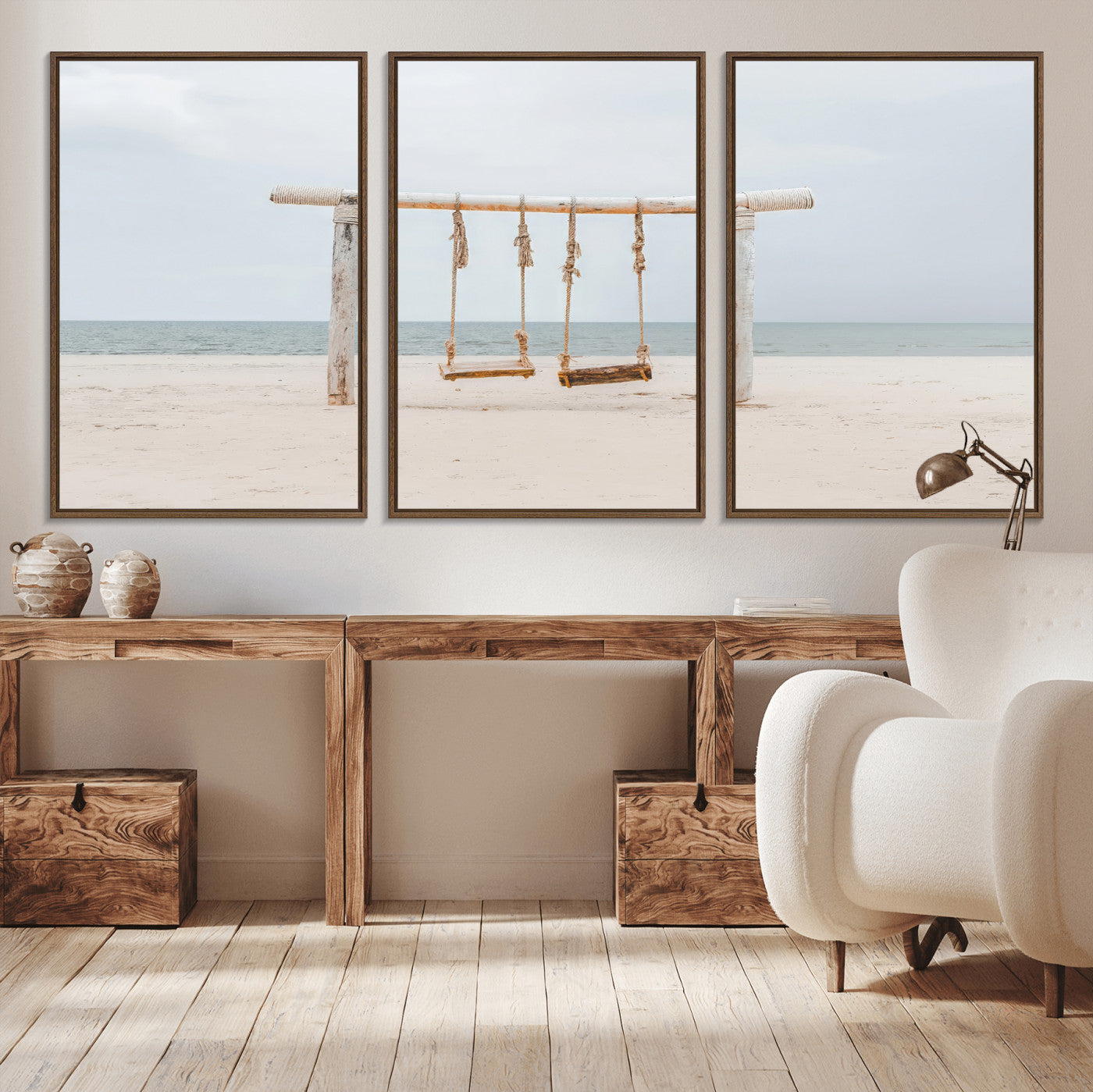 A rustic wooden beach swing stands on a serene sandy shore with an ocean horizon in the background, creating a tranquil and dreamy coastal escape.
