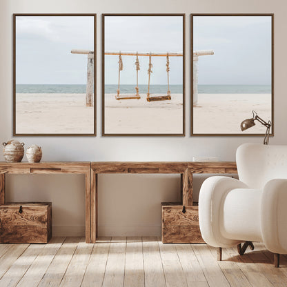 A rustic wooden beach swing stands on a serene sandy shore with an ocean horizon in the background, creating a tranquil and dreamy coastal escape.