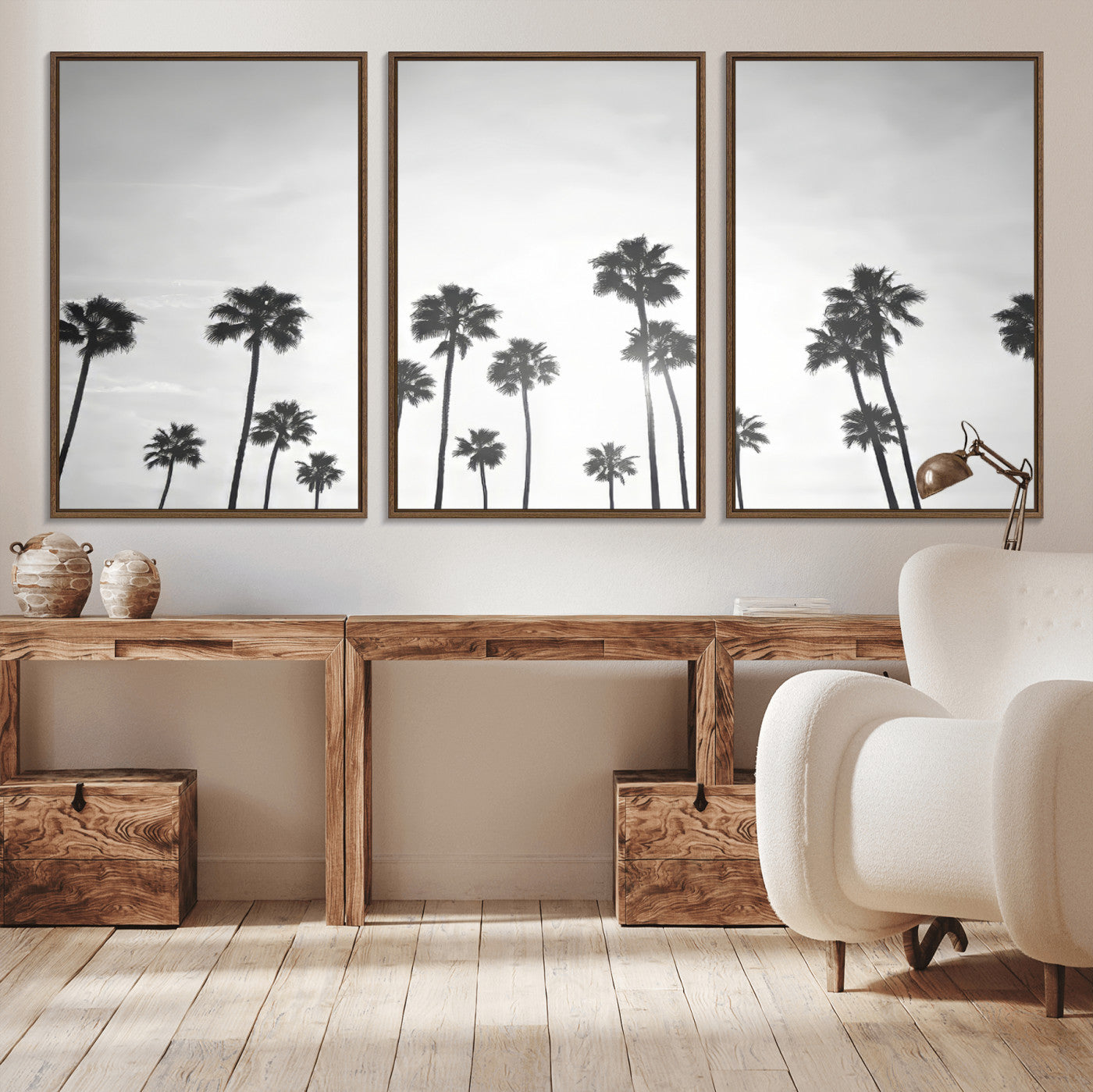 A black and white minimalist scene featuring tall palm trees silhouetted against a bright sky, creating a dreamy and timeless tropical aesthetic.