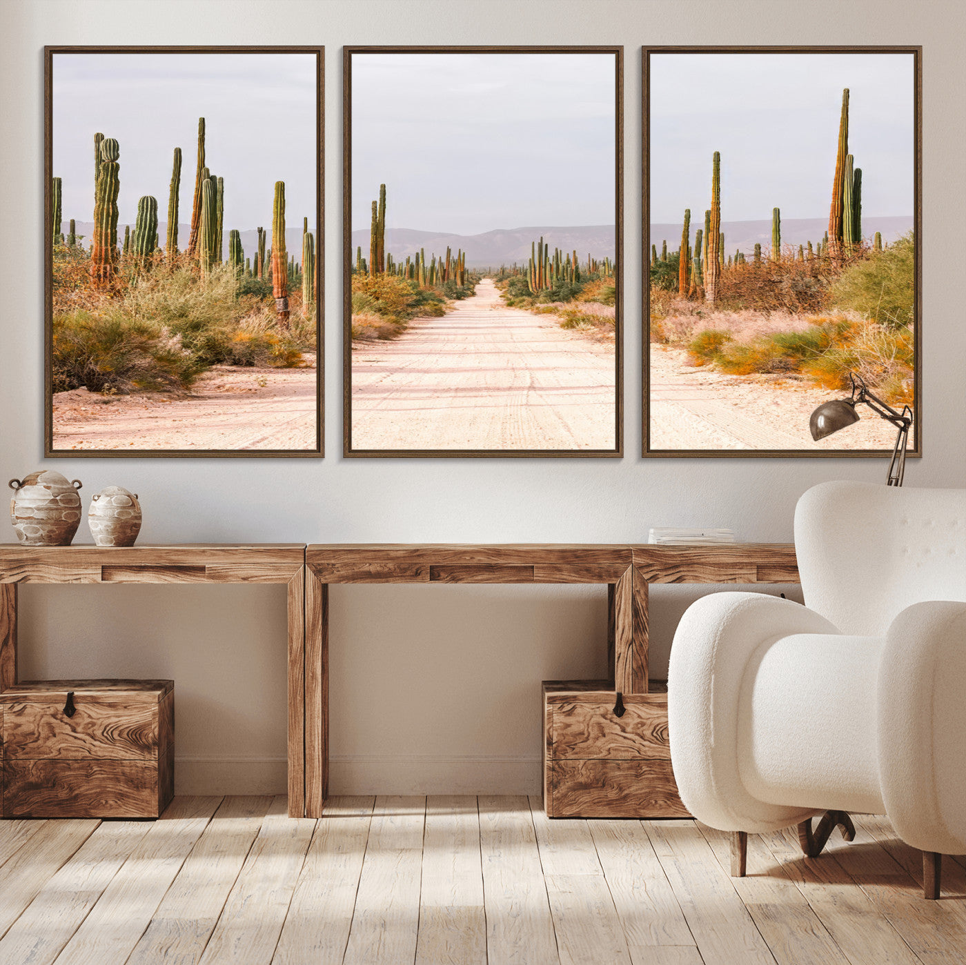 A desert road lined with saguaro cacti under a golden sky, creating a warm southwestern feel, perfect for boho or rustic decor.