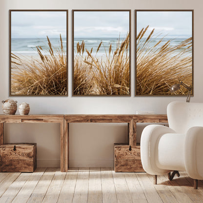 Canvas of golden beach grass swaying by the ocean under a soft cloudy sky, perfect for neutral-toned or coastal minimalist decor.