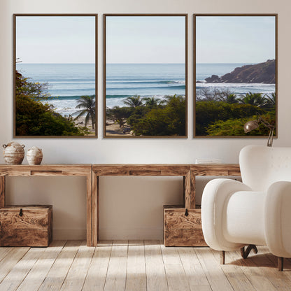 View of calm ocean waves with palm trees and a tropical coastline, ideal for coastal boho or beach-themed wall decor.