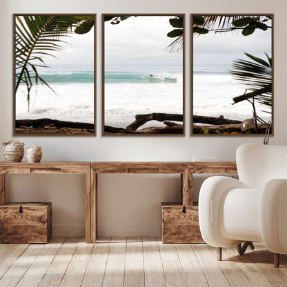 Tropical beach view with palm trees and surfer riding a wave, perfect for boho or coastal-inspired interior wall decor.