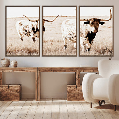 Two Texas longhorn cows standing in a sepia-toned pasture, evoking rustic charm perfect for farmhouse or western country interiors. (