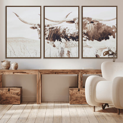 Two longhorn cows standing in a sepia-toned pasture with soft light, ideal for rustic or farmhouse-themed neutral wall decor.