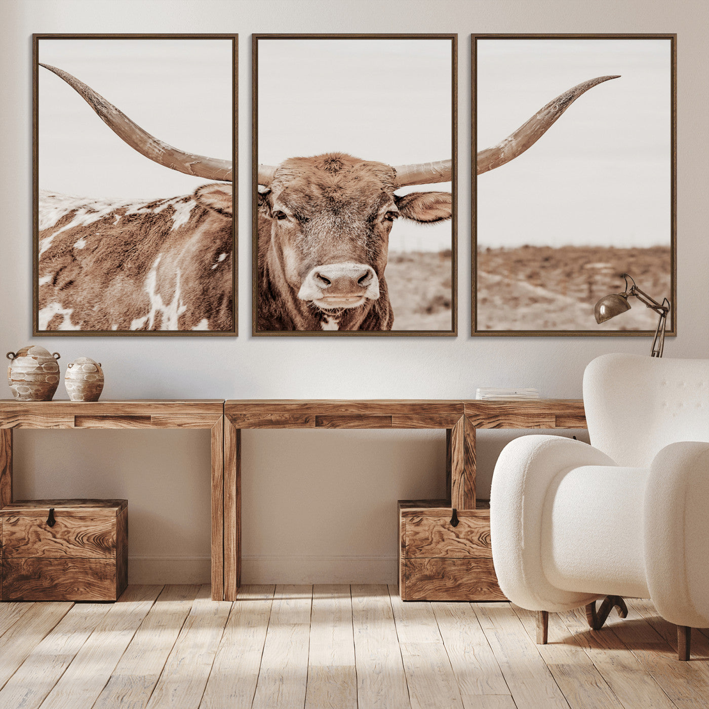 A longhorn cow in soft beige desert tones, standing calmly in open land, perfect for neutral western or rustic farmhouse interiors.