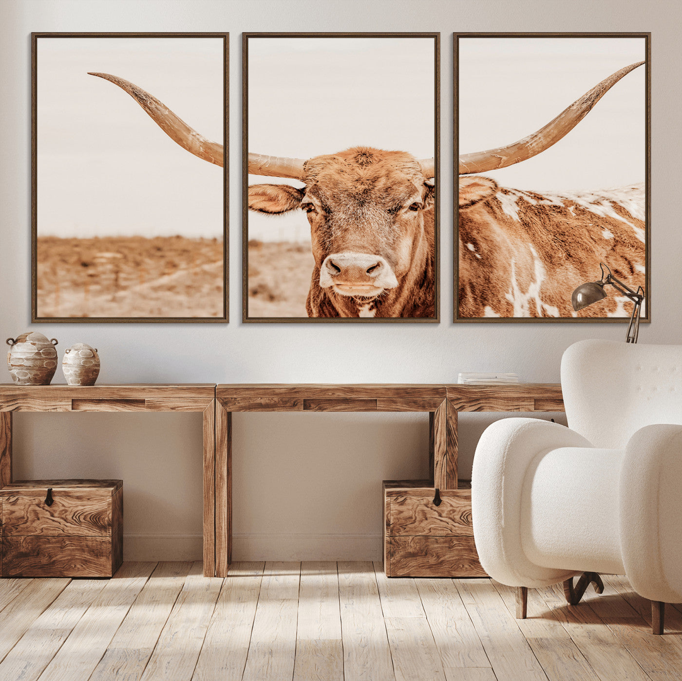 A longhorn bull standing proudly in a sunlit desert field with warm neutral tones, ideal for rustic western or farmhouse interiors.