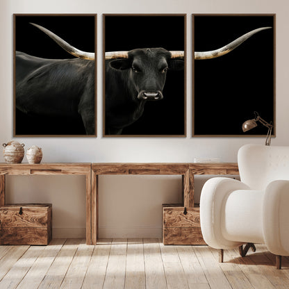 Close-up of a black Texas longhorn with large curved horns on black background, ideal for rustic farmhouse or modern western interiors.