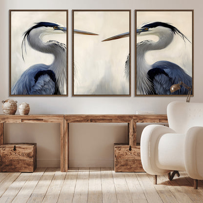Two blue herons facing each other on a soft neutral background, ideal for coastal, tranquil, or nature-inspired minimalist interiors.