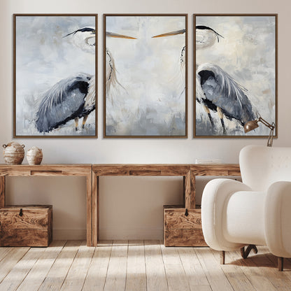 Two herons facing each other on a soft-toned background with blue-grey feathers, perfect for tranquil, coastal or nature-themed interiors.