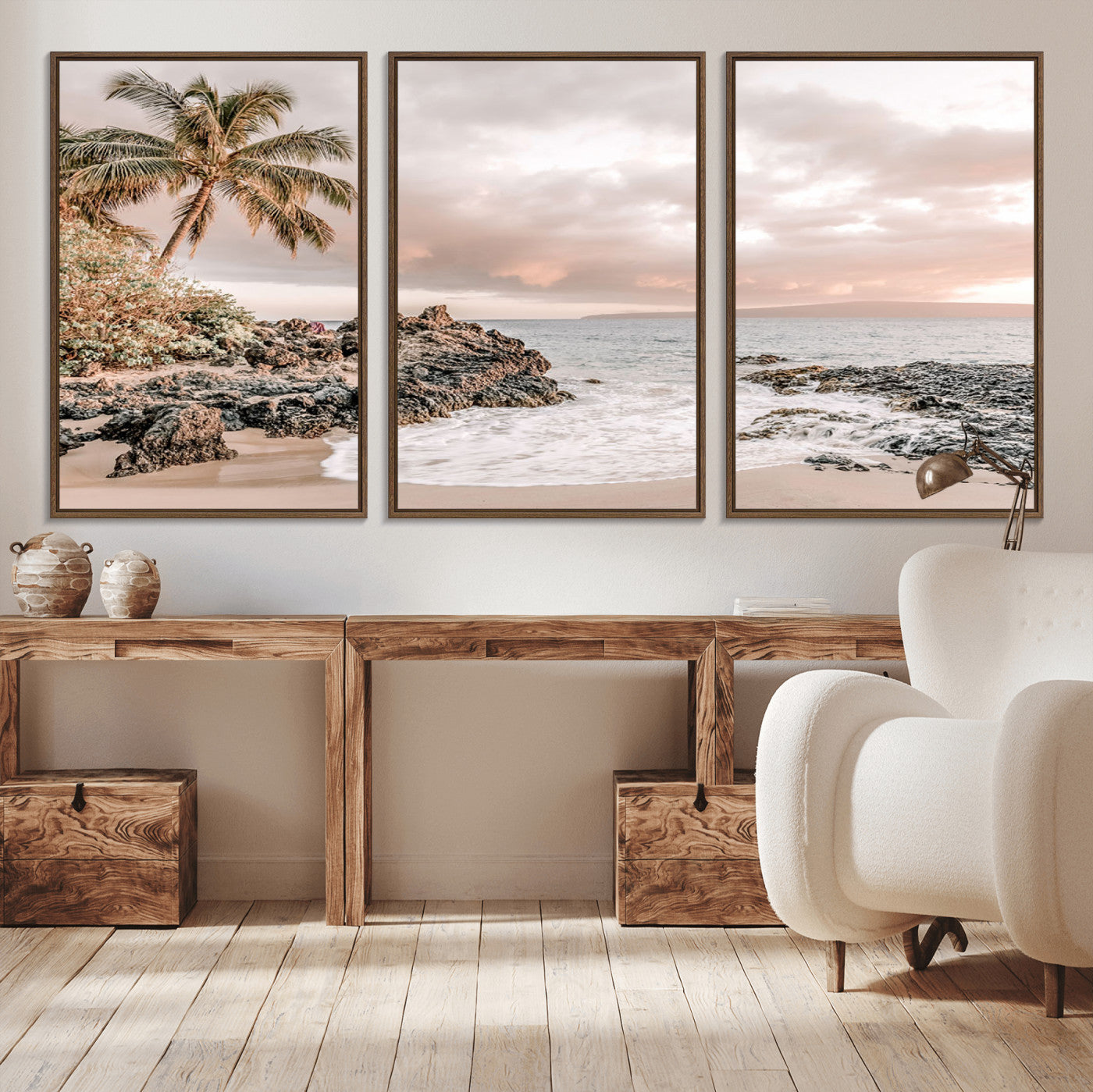 A peaceful beach scene with a palm tree and rocks, soft waves washing onto the shore under a soft pastel sky at sunset.
