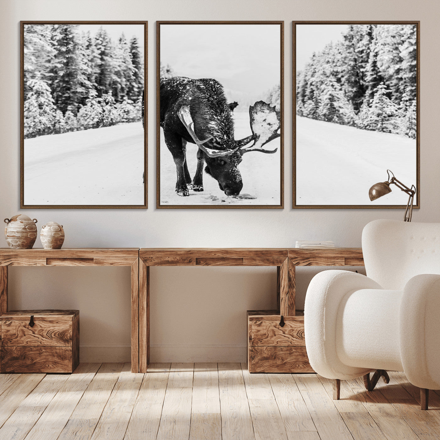 A majestic moose grazing in the snow-covered wilderness, surrounded by snow-covered trees, creating a peaceful winter scene.