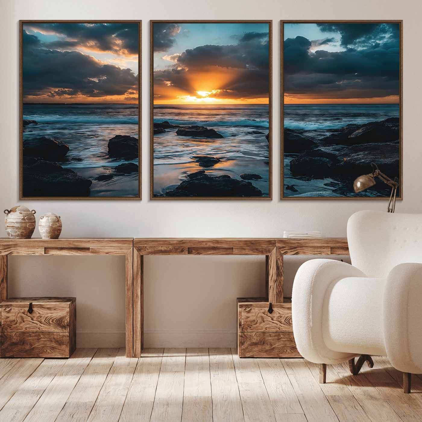 An awe-inspiring sunset over the ocean with rays of light piercing through dramatic clouds, creating a beautiful seascape with rocks in the foreground.