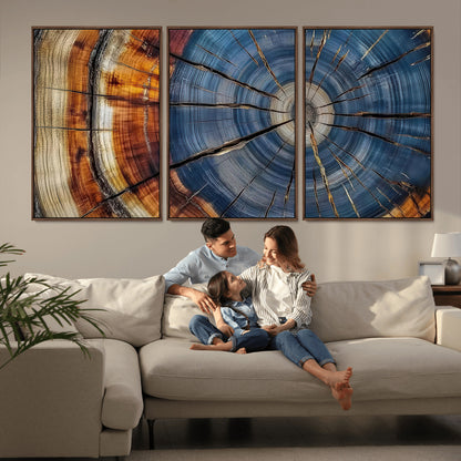 A stunning close-up view of a tree trunk, showcasing the intricate growth rings in a vibrant mix of warm browns, cool blues, and hints of natural texture.