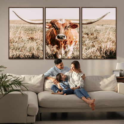 Framed longhorn cow canvas wall art with rustic prairie background, western animal print perfect for farmhouse or ranch style decor