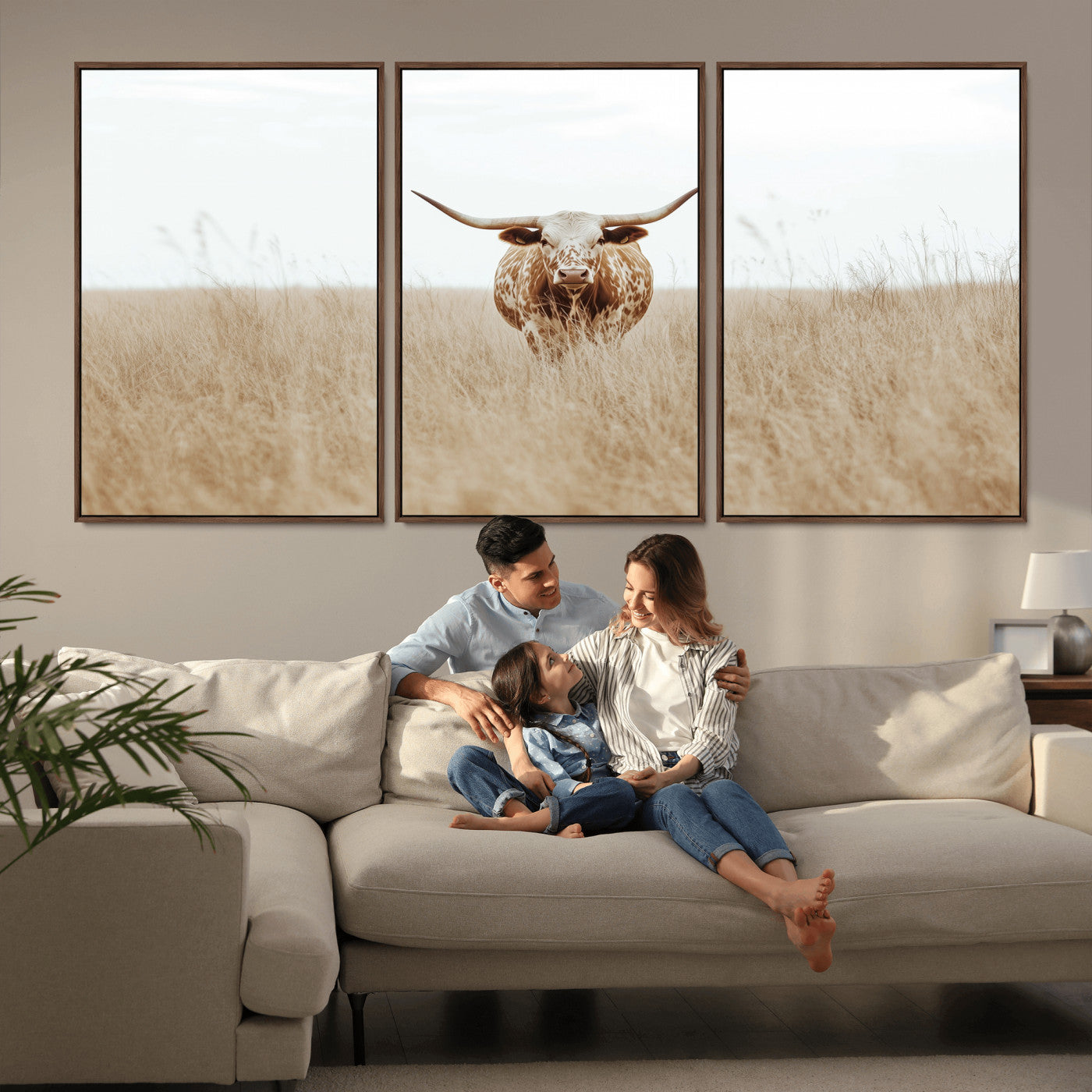 Texas Longhorn bull standing alone in dry grass with neutral tones, ideal for rustic western or cowboy-themed wall decor.